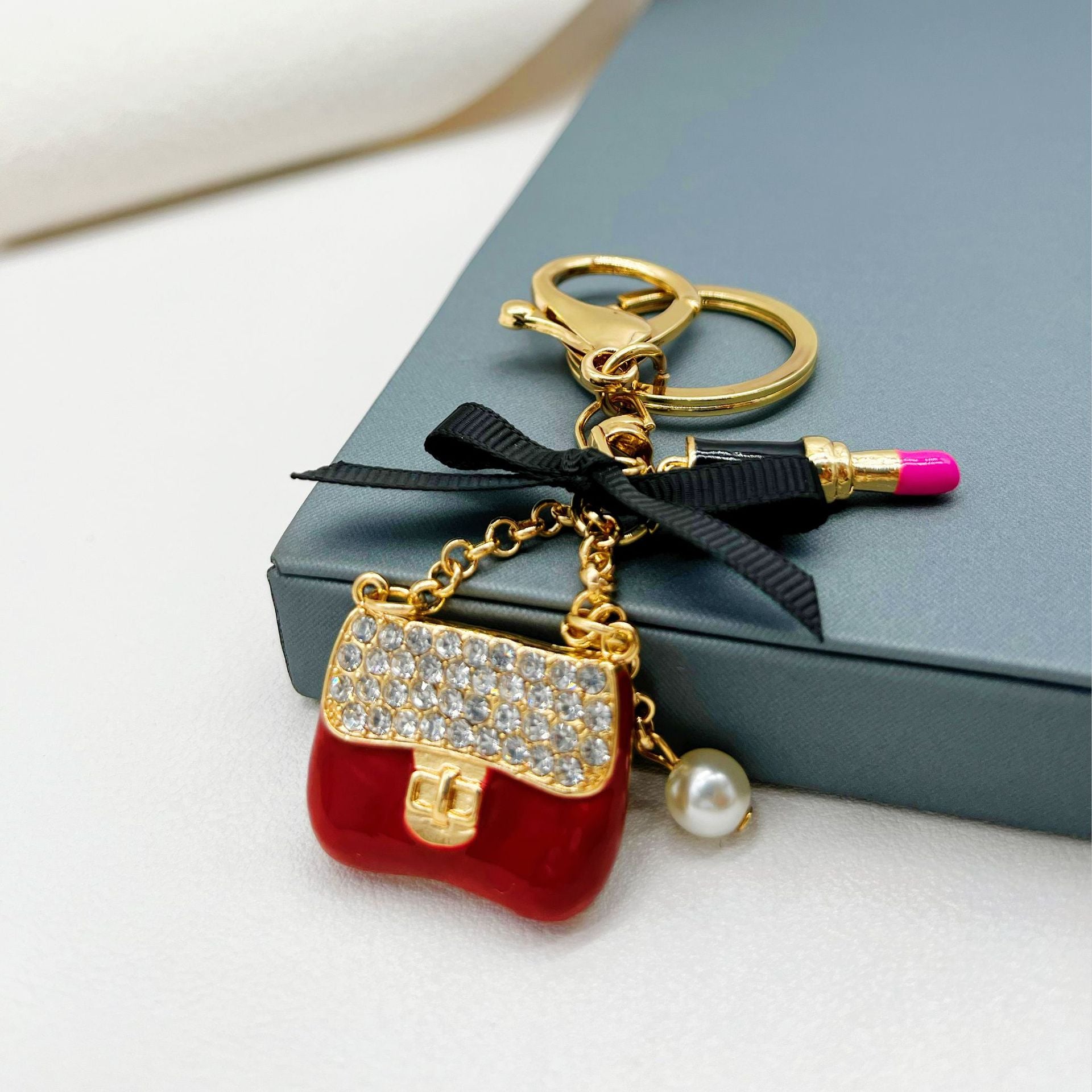 Wholesale Rhinestone Lipstick Bow Small Shoulder Bag Alloy Keychain